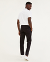 Back view of model wearing Black Ultimate Chinos, Athletic Fit.