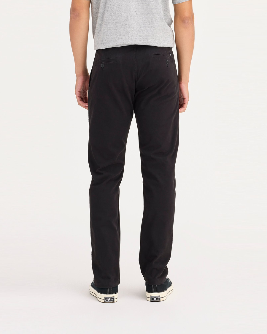 Back view of model wearing Black Ultimate Chinos, Athletic Fit.