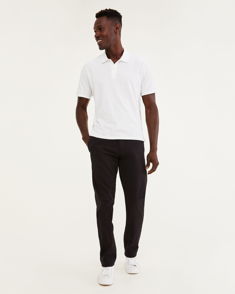 Front view of model wearing Black Ultimate Chinos, Athletic Fit.