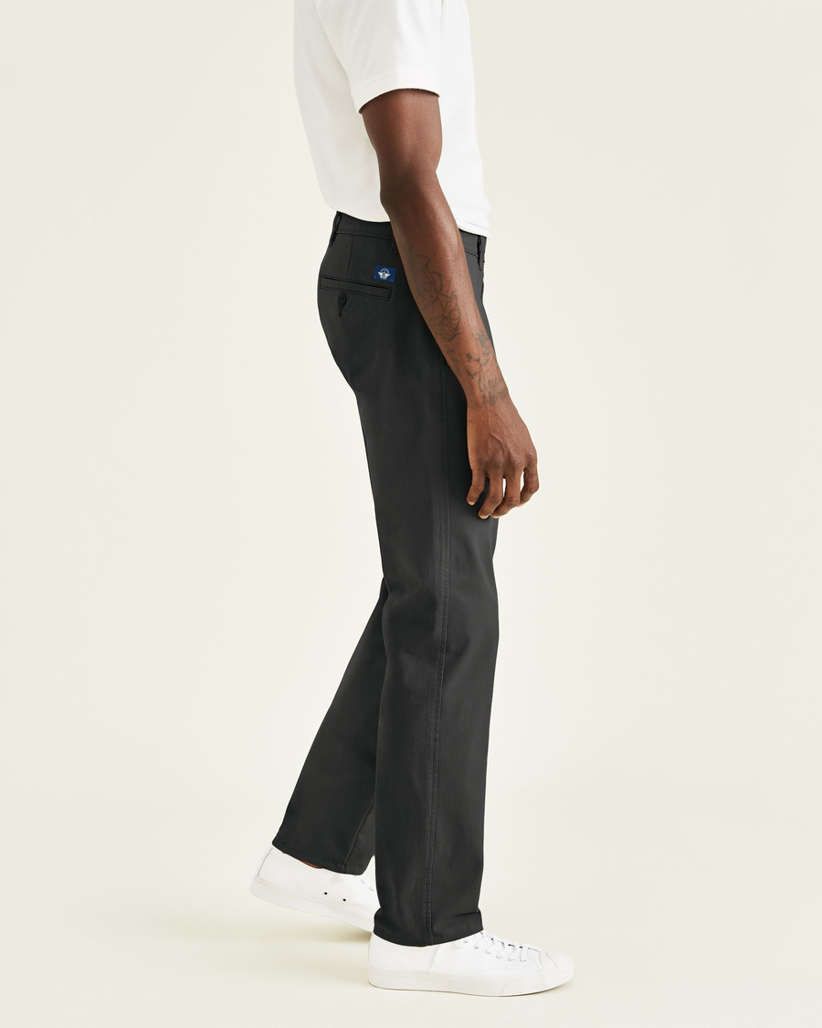 Side view of model wearing Black Ultimate Chinos, Straight Fit.