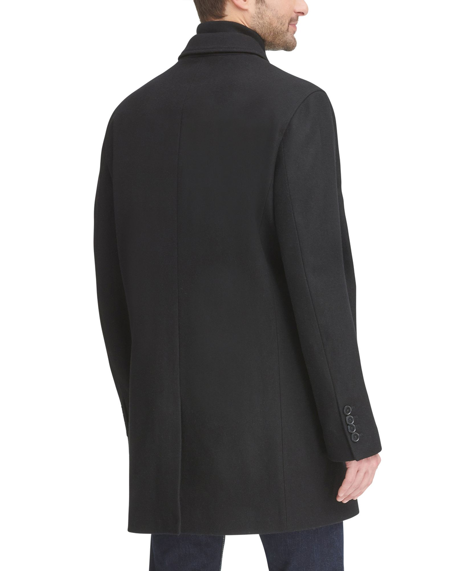 Back view of model wearing Black Wool Blend Top Coat with Bib.