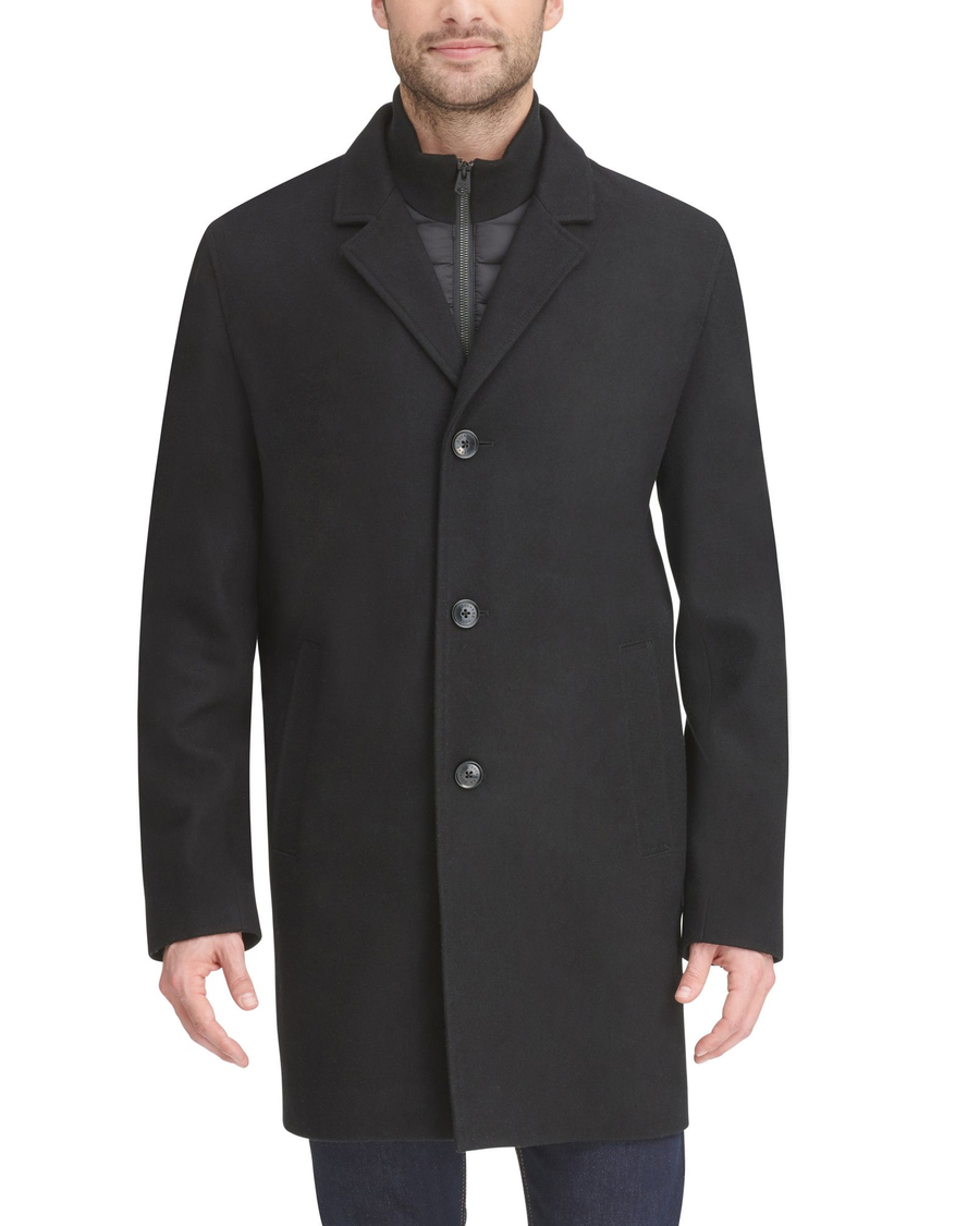 Front view of model wearing Black Wool Blend Top Coat with Bib.