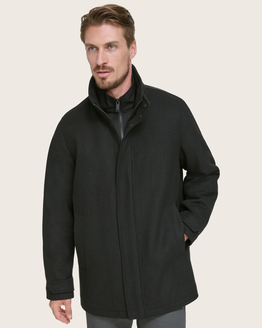 View of model wearing Black Wool Blend Walking Coat w/ Bib.