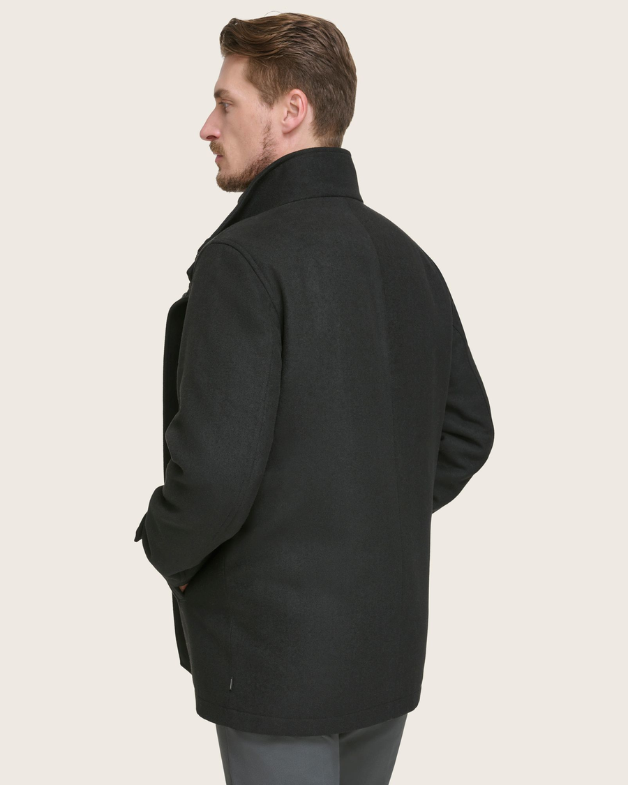 Back view of model wearing Black Wool Blend Walking Coat w/ Bib.