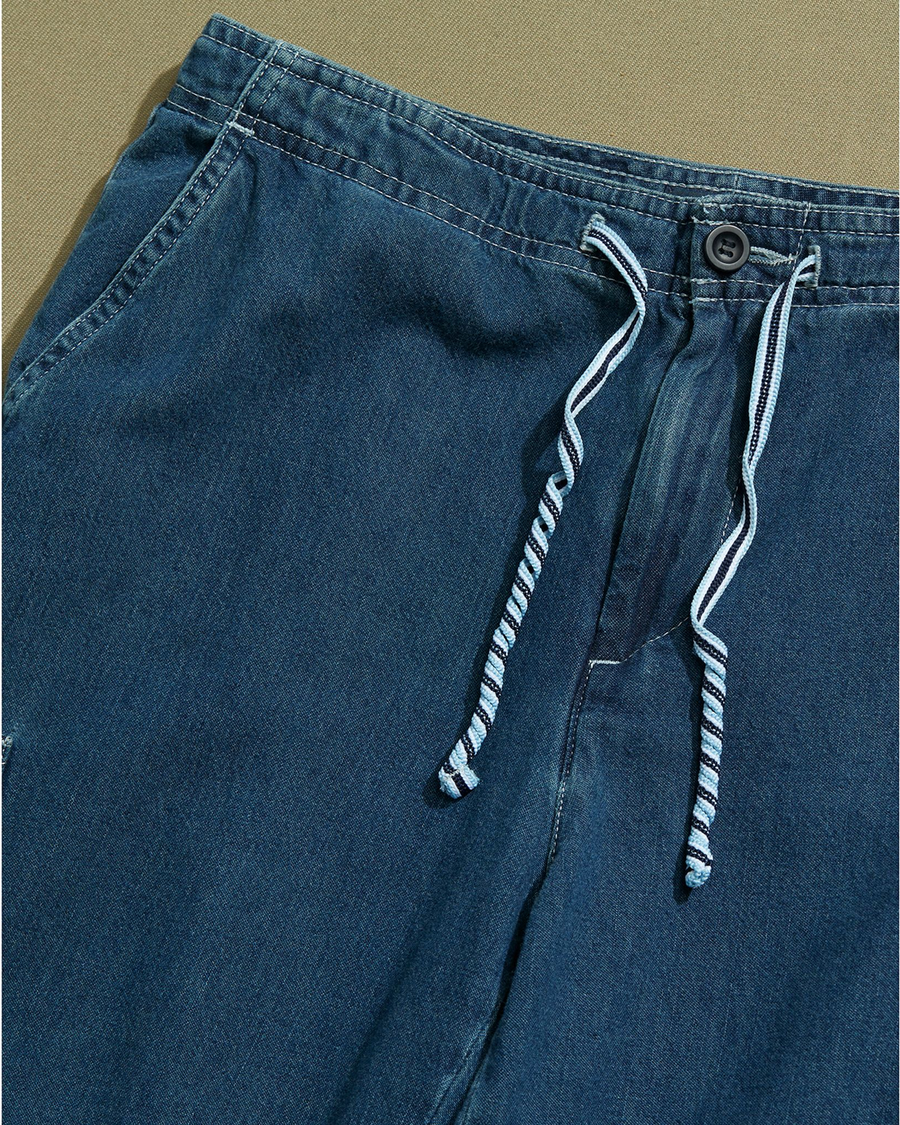 View of model wearing Blue Denim Cargo Pants with Draw String Waist - 28 x 22.