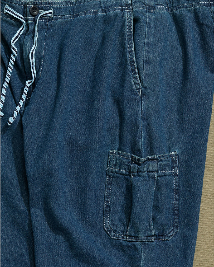 View of model wearing Blue Denim Cargo Pants with Draw String Waist - 28 x 22.