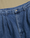 View of model wearing Blue Denim Double Pleated Pants - 32 x 28.