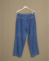 Back view of model wearing Blue Denim Double Pleated Pants - 32 x 28.