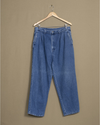 Front view of model wearing Blue Denim Double Pleated Pants - 32 x 28.