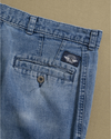 View of model wearing Blue Denim Double Pleated Pants - 32 x 29.