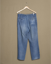 Back view of model wearing Blue Denim Double Pleated Pants - 32 x 29.