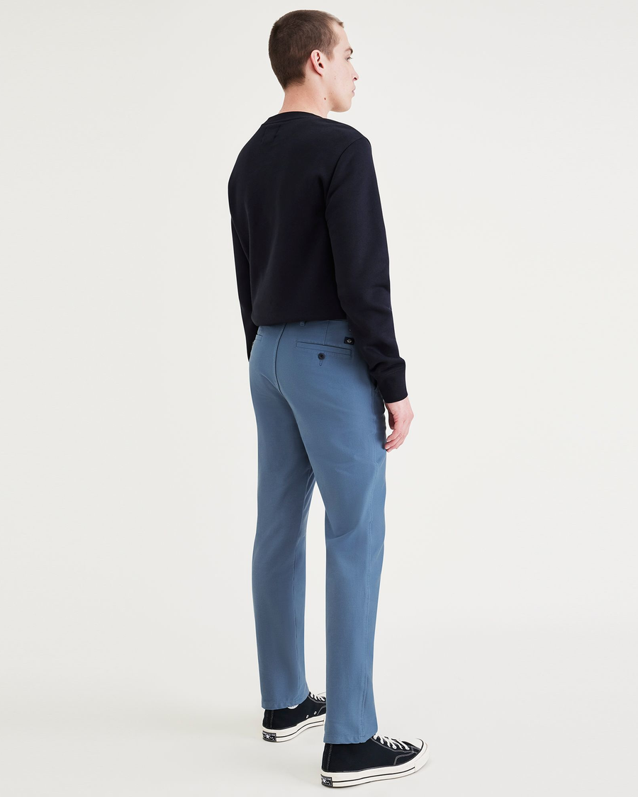 Back view of model wearing Blue Fusion Comfort Knit Chinos, Slim Fit.