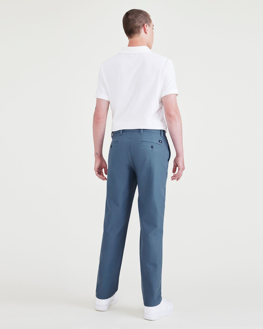 Back view of model wearing Blue Fusion Comfort Knit Chinos, Straight Fit.