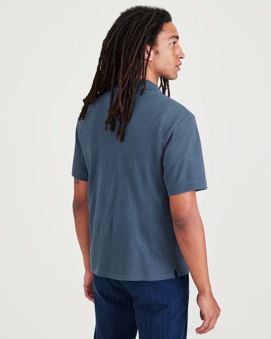Back view of model wearing Blue Fusion Rib Collar Polo, Slim Fit.