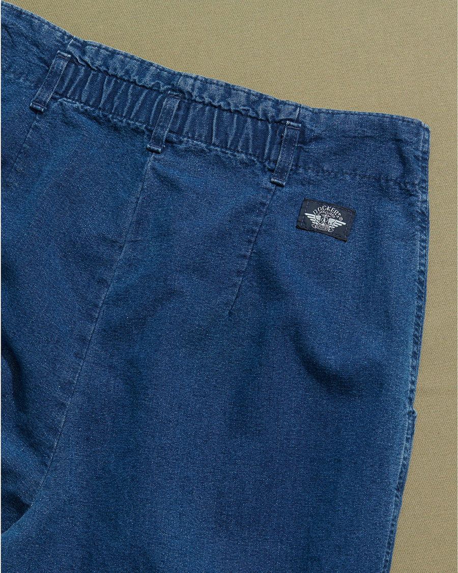 View of model wearing Blue Made in USA, Double Pleated Denim Pants - 26 x 30.