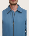 View of model wearing Blue Microtwill Relaxed Bomber Jacket.