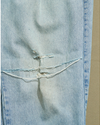 View of model wearing Blue Reverse Double Pleated Denim Pants - 34 x 33.