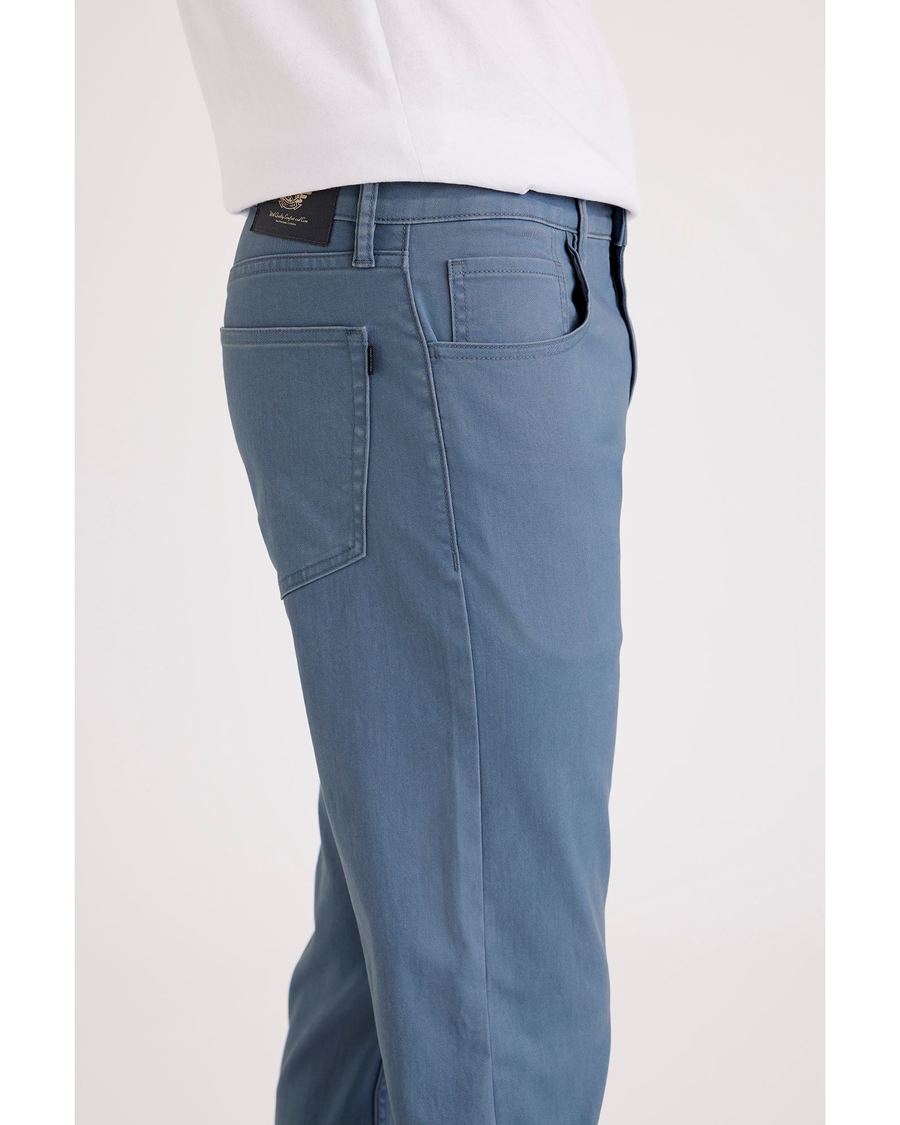 Side view of model wearing Bluefin Jean Cut Pants, Straight Fit.