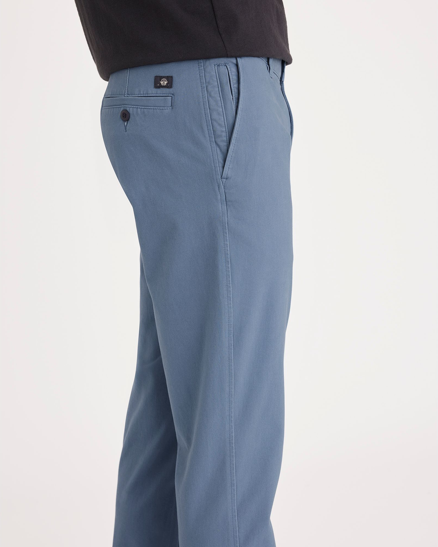 Side view of model wearing Bluefin Ultimate Chino, Slim Fit.