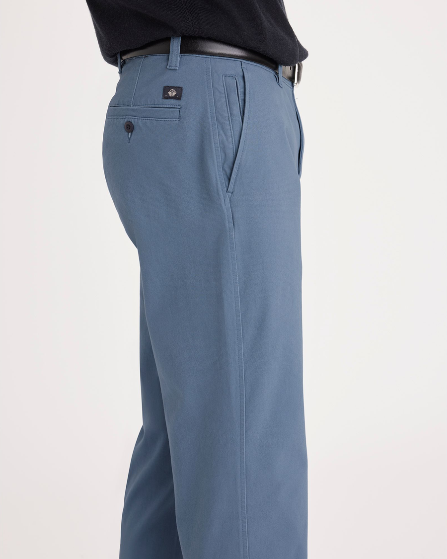 Side view of model wearing Bluefin Ultimate Chinos, Straight Fit.