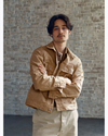 View of model wearing Broad Khaki Dockers® x Transnomadica Button-Down Shirt.