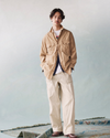 View of model wearing Broad Khaki Dockers® x Transnomadica Button-Down Shirt.