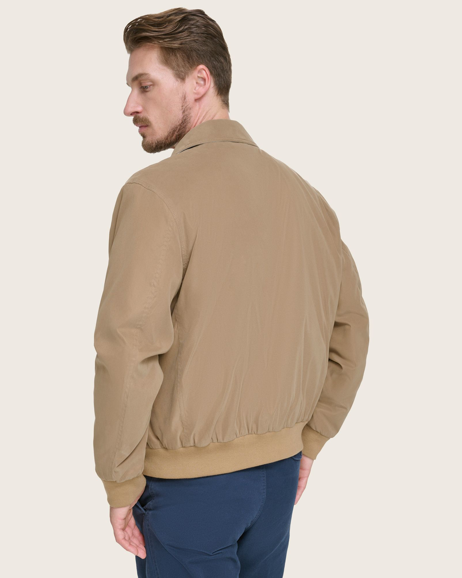 Back view of model wearing Brown Microtwill Relaxed Bomber Jacket.