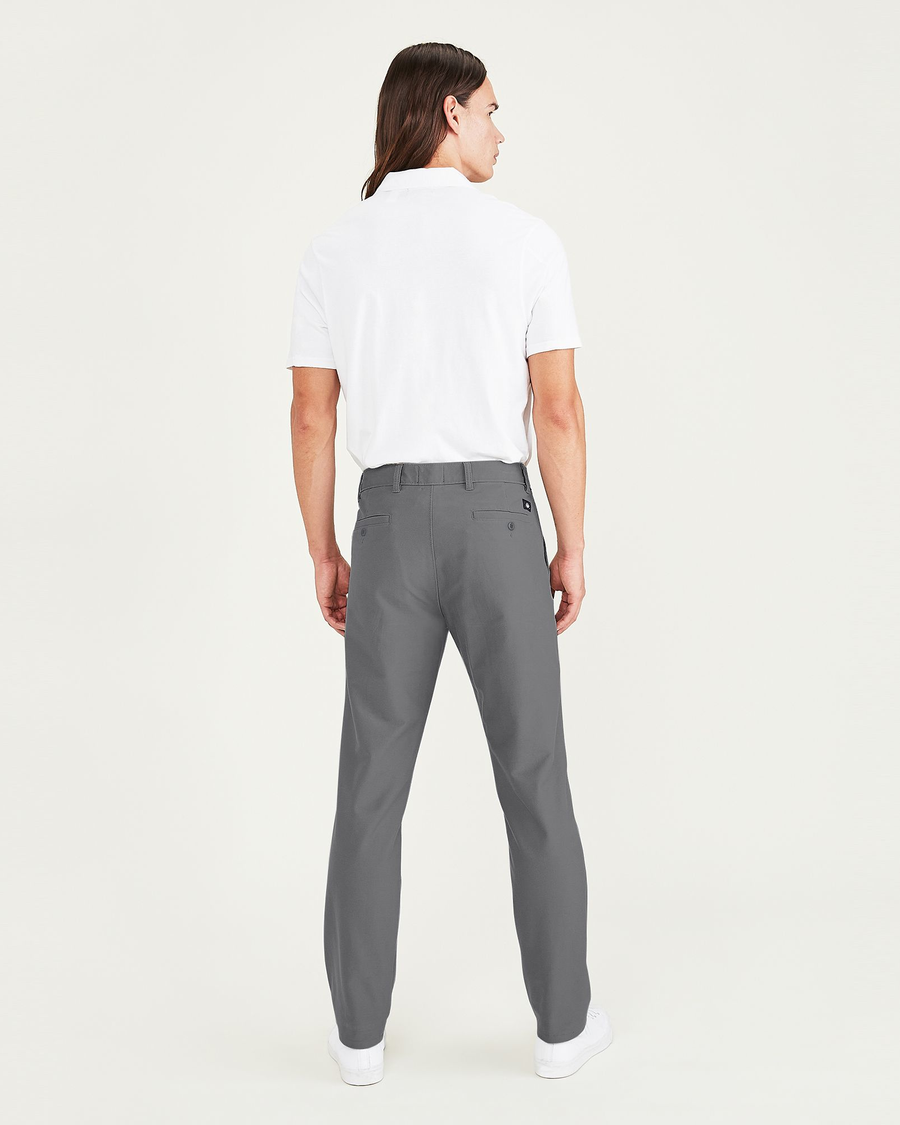 Back view of model wearing Burma Grey Comfort Knit Chinos, Slim Fit.