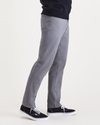 Side view of model wearing Burma Grey Jean Cut Pants, Athletic Fit.