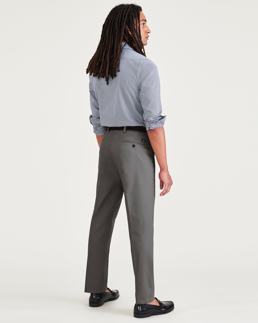 Back view of model wearing Burma Grey Signature Iron Free Khakis, Slim Fit with Stain Defender®.
