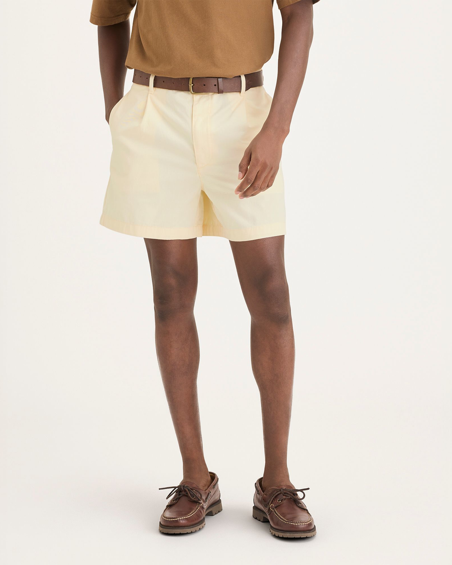 Front view of model wearing Buttercream Eighty-Six Pleated Short.