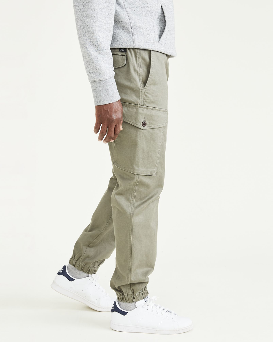 Side view of model wearing Camo Cargo Joggers, Straight Tapered Fit.