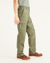 Side view of model wearing Camo Cargo Pants, Relaxed Fit.