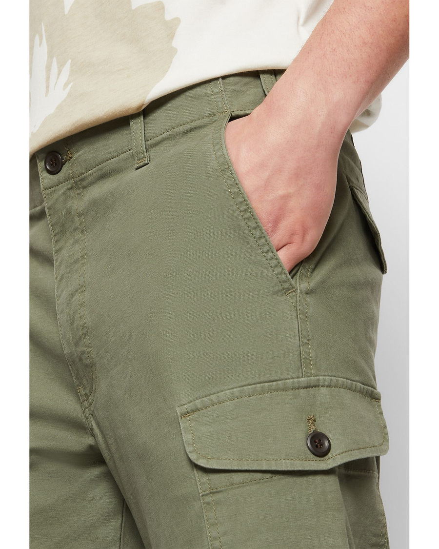 View of model wearing Camo Cargo Pants, Slim Tapered Fit.