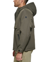 Side view of model wearing Camo Olive Flex Tech Welded Flange Hoodie.