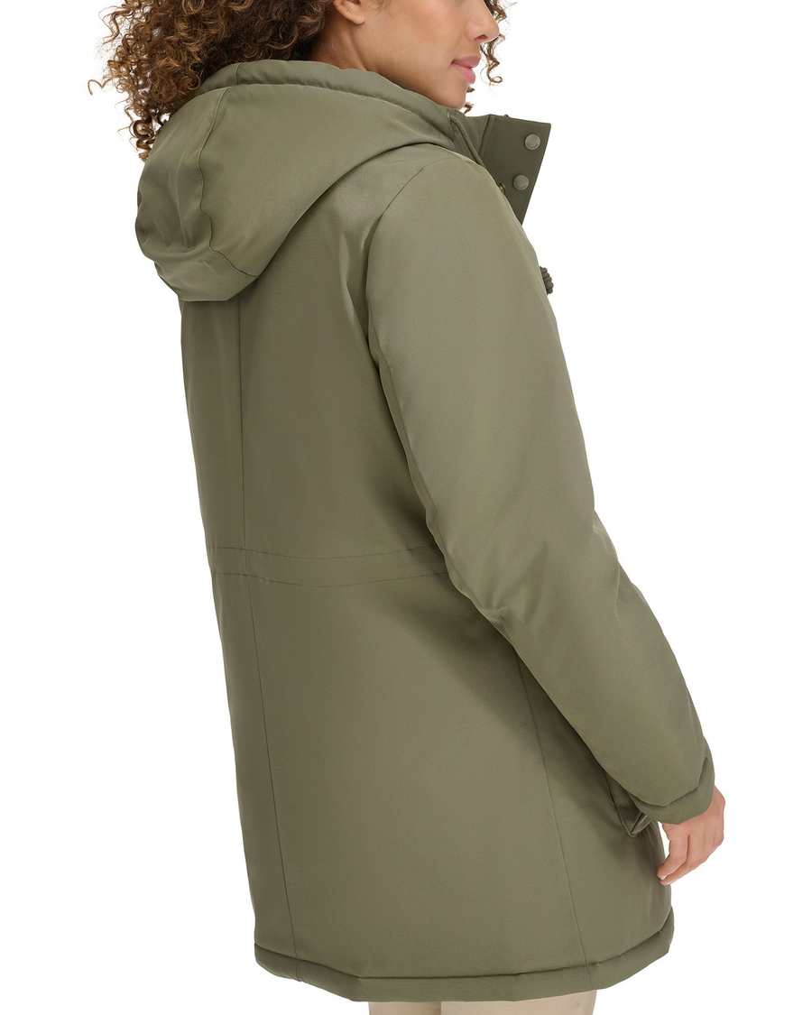 View of model wearing Camo Olive Hooded Parka.