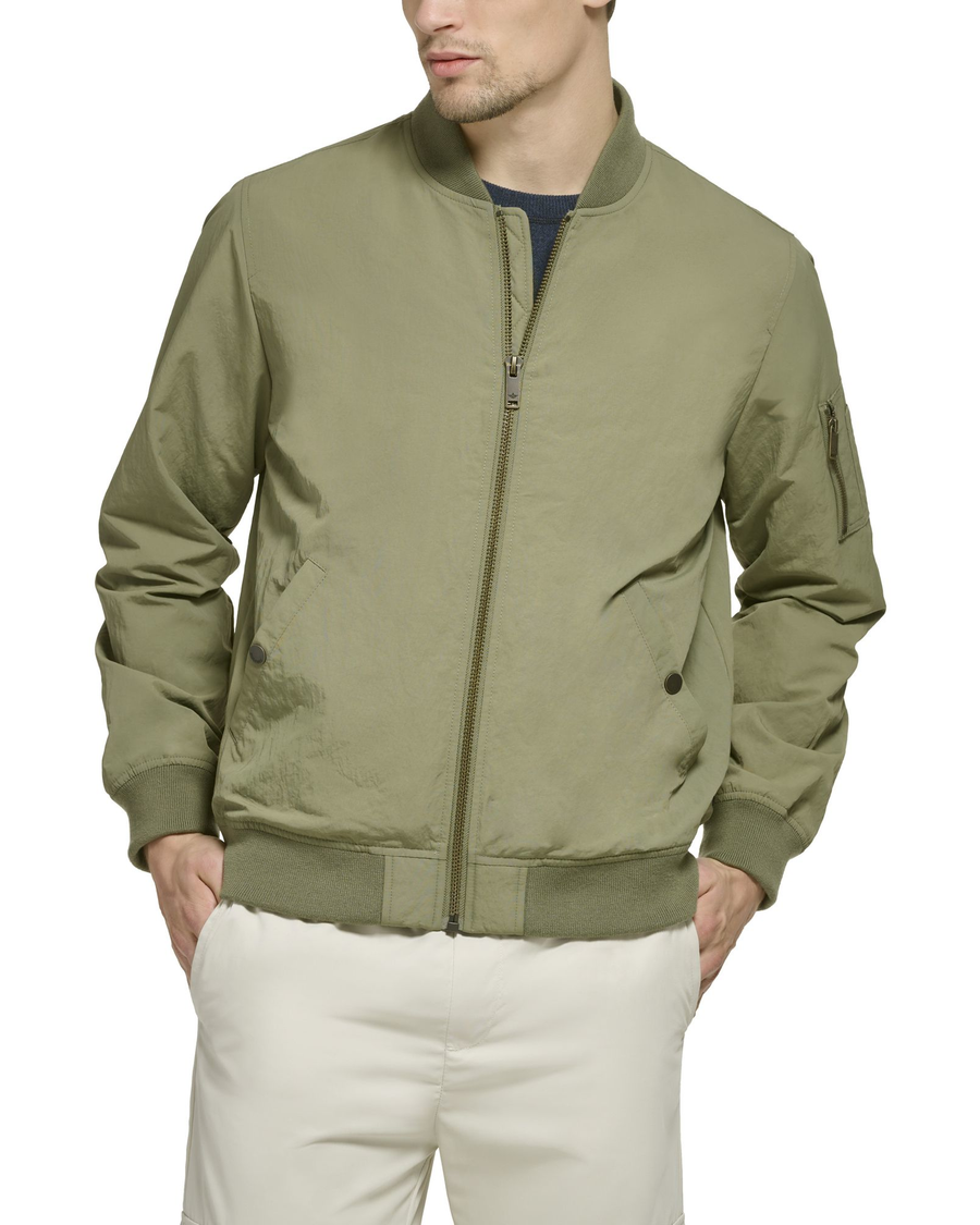 View of model wearing Camo Olive Recycled Sail Nylon Bomber Jacket.