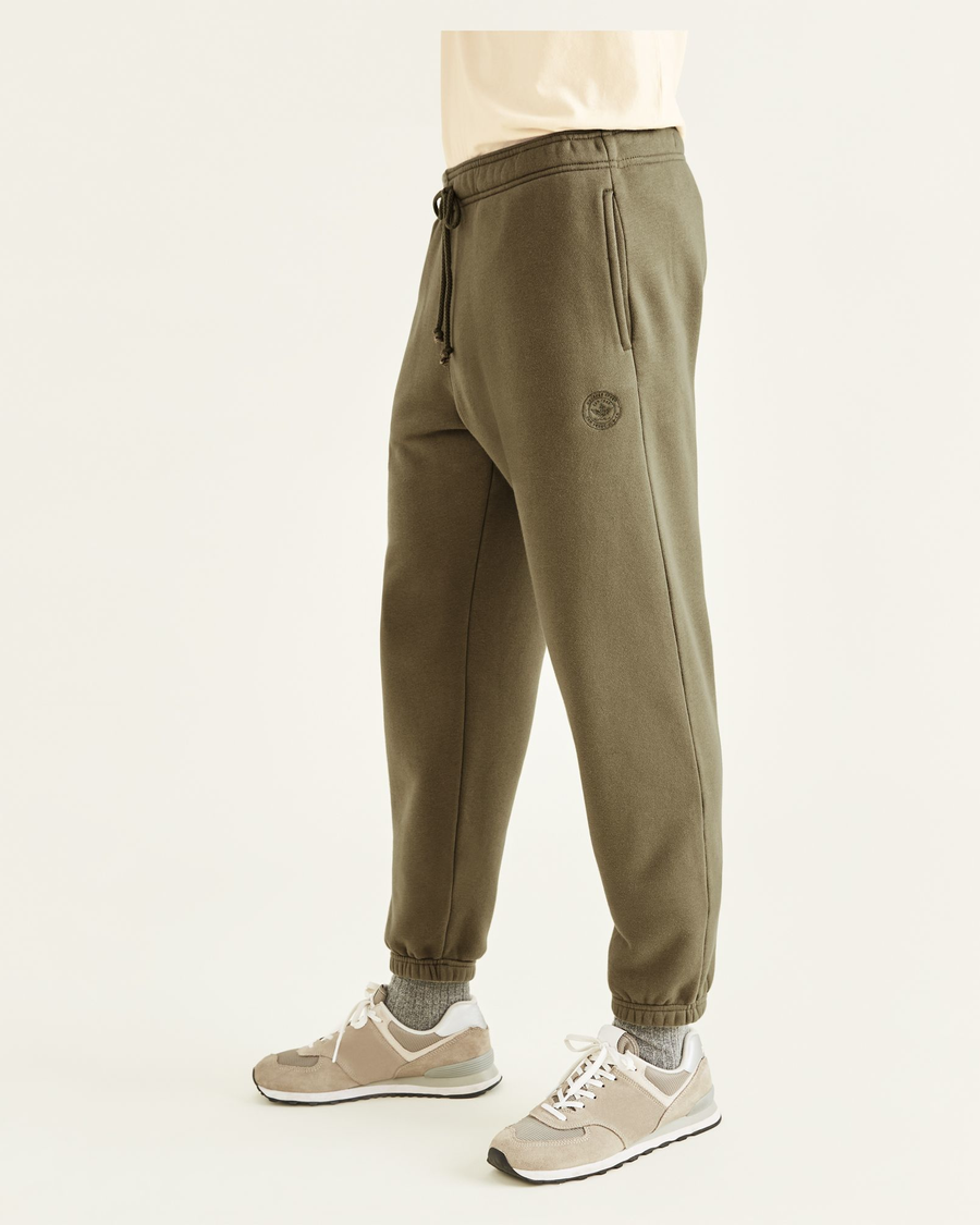 Side view of model wearing Camo Sport Sweatpants, Straight Fit.