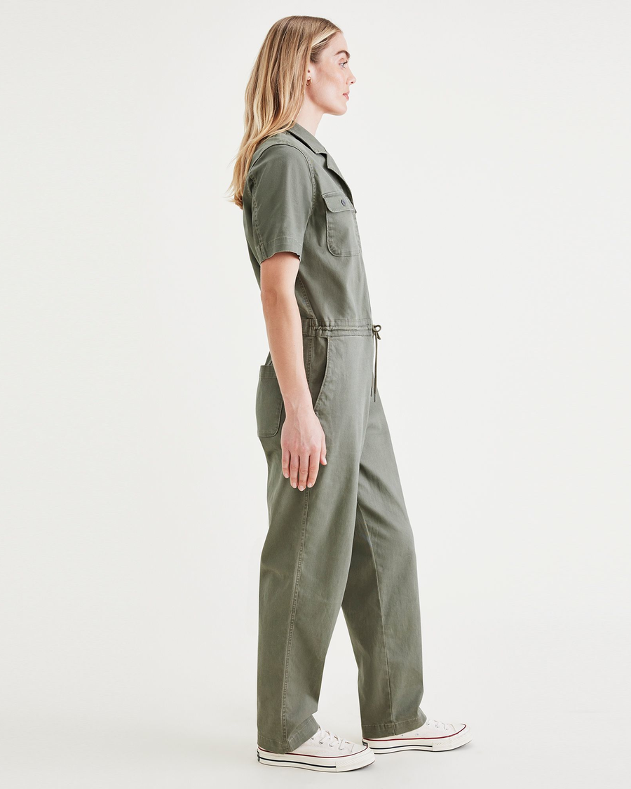 Side view of model wearing Camo Utility Jumpsuit.