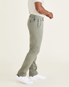 Side view of model wearing Camo Workday Khakis, Slim Fit.