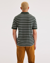 Back view of model wearing Caparis Deep Forest Rib Collar Polo, Slim Fit.