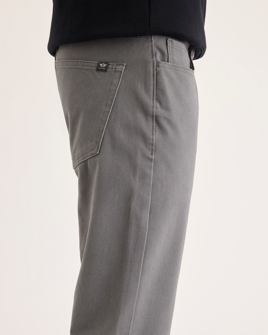 Side view of model wearing Car Park Grey All-Day 5-Pocket, Slim Fit.