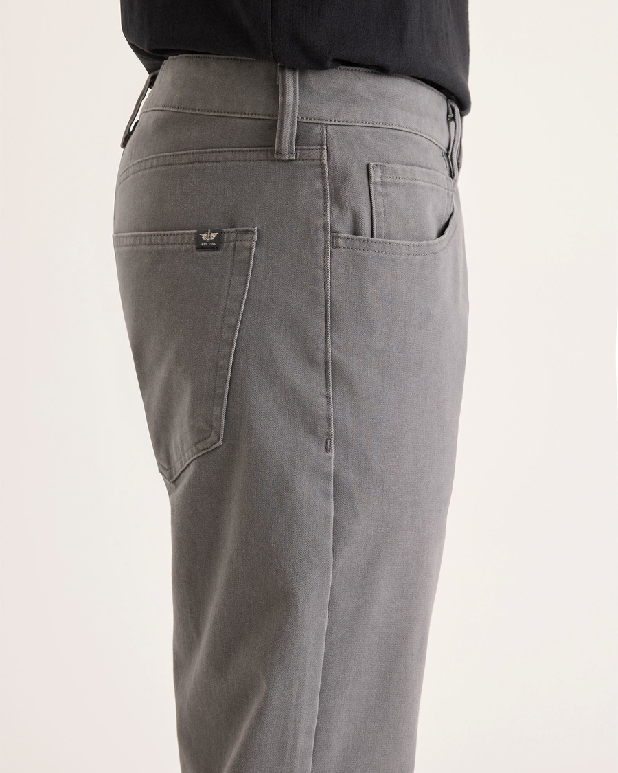 Side view of model wearing Car Park Grey All-Day 5-Pocket, Straight Fit.