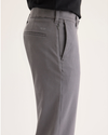 Side view of model wearing Car Park Grey Go Activeflex Chino, Slim Fit.