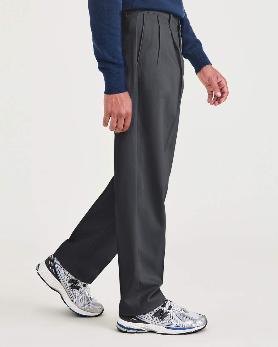 Side view of model wearing Charcoal Heather Signature Iron Free Khakis, Pleated, Relaxed Fit with Stain Defender®.