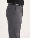 Side view of model wearing Charcoal Heather Signature Iron Free Khakis, Slim Fit with Stain Defender®.