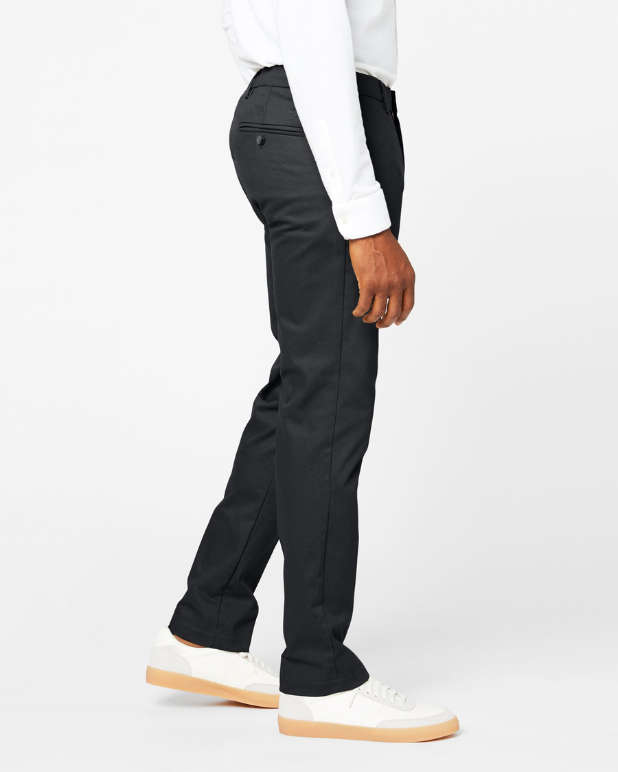 Side view of model wearing Charcoal Signature Khakis, Athletic Fit.