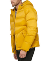 Side view of model wearing Chimera Quilted Arctic Hooded Parka.
