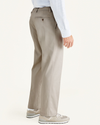 Side view of model wearing Cloud Easy Khakis, Pleated, Classic Fit (Big and Tall).