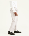 Side view of model wearing Cloud Easy Khakis, Pleated, Classic Fit.